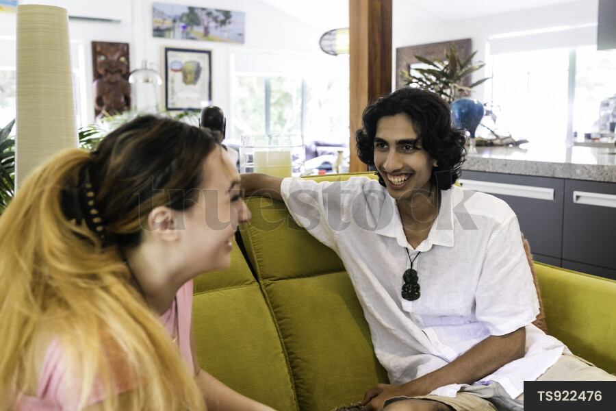 Friends sitting on sofa