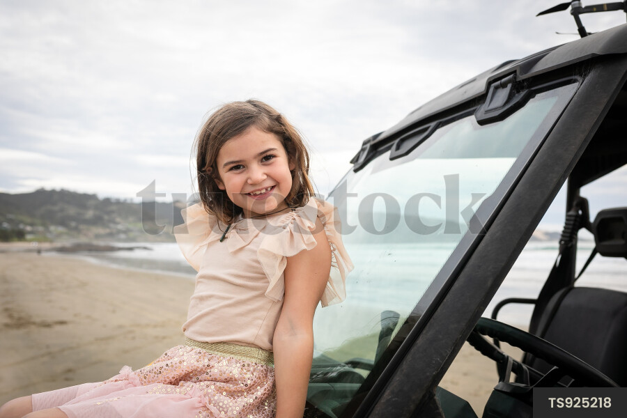Girl sitting on beach buggy