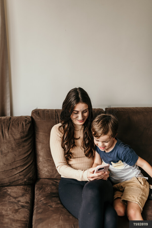 Mother and Son Using Phone