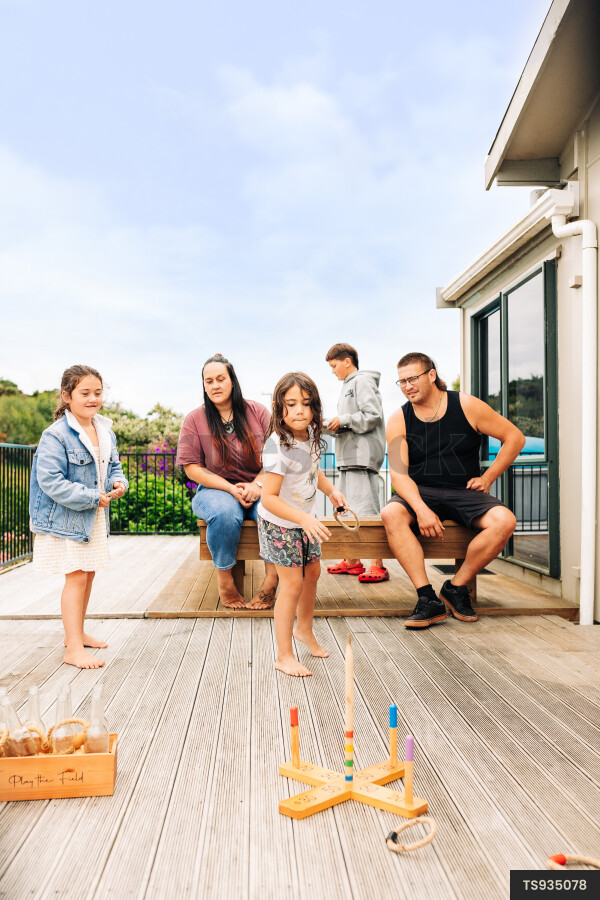 Family playing on deck