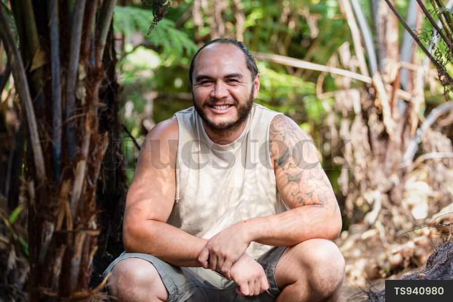 Portrait of happy Maori man with moko tattoo