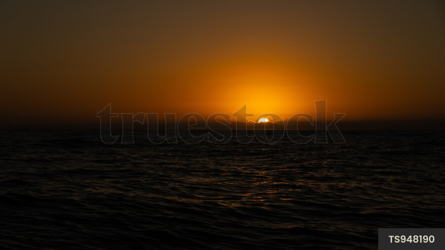 Sunset over sea in Haast