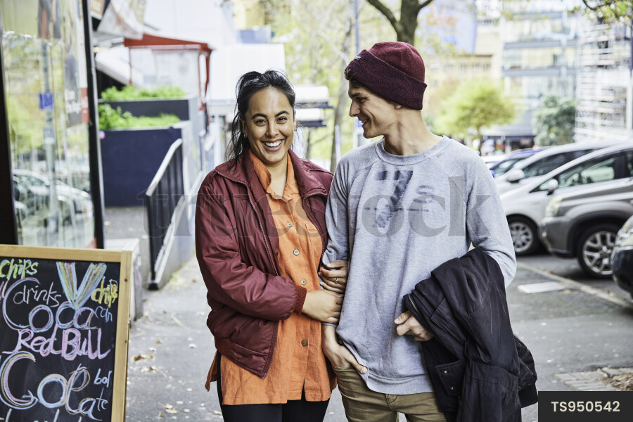 Couple Walking along Street