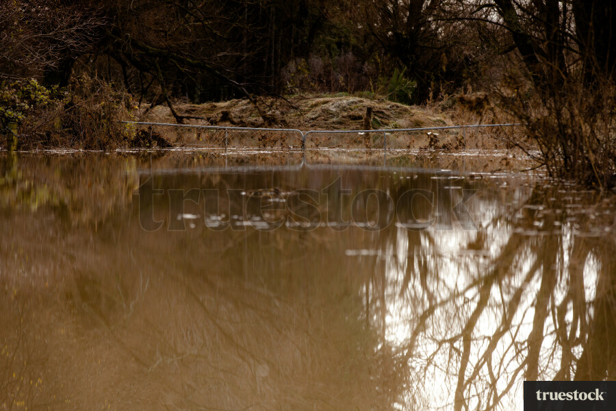 Rising river water and debris from flooding