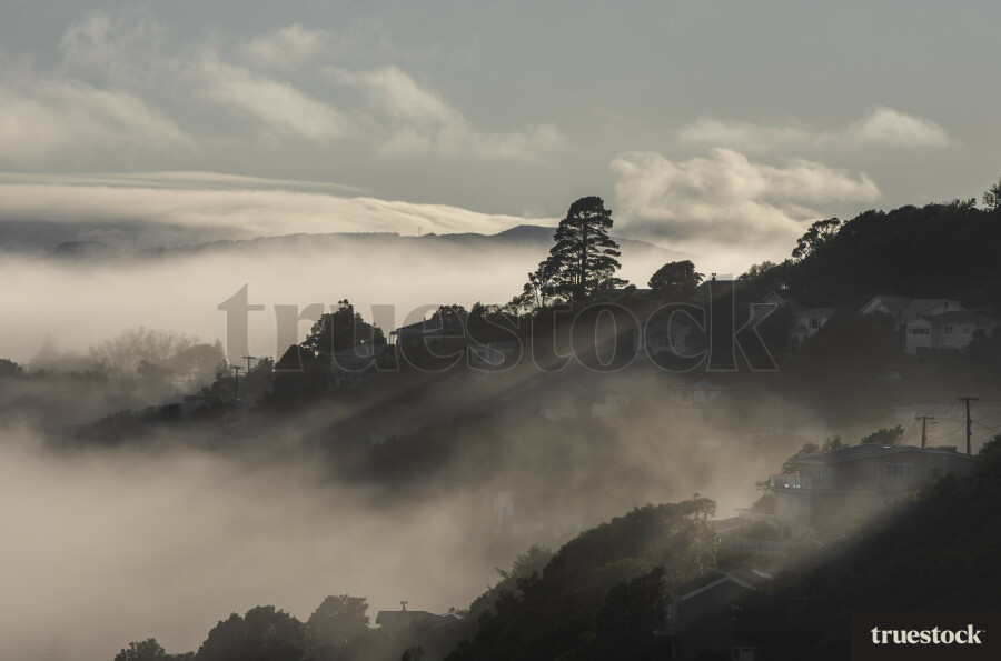 Panorama of low hanging clouds over the hilltops