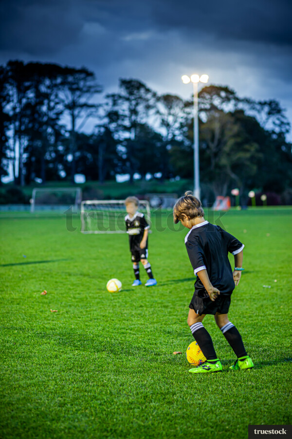 Children at football training at night