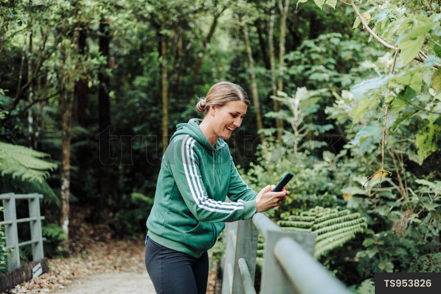 Woman Using Phone on Hike