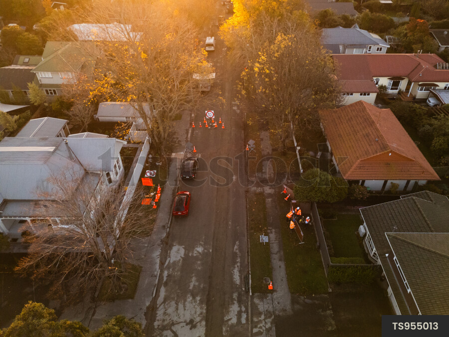 Aerial view of roadworks on road in residential neighborhood