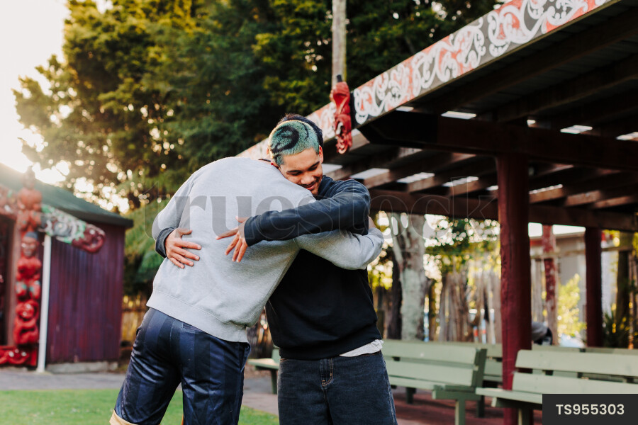 Guys Hug at Marae