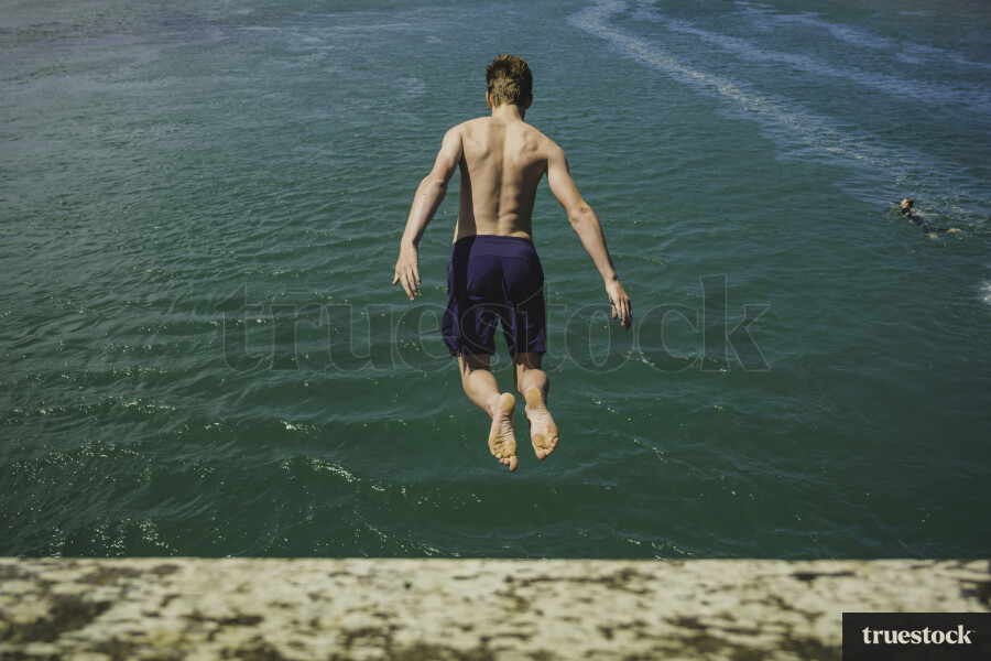 Guy Swimming at the Beach