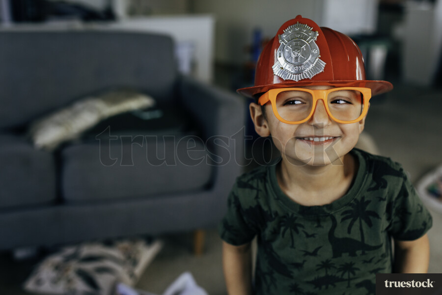 Young boy playing dress up