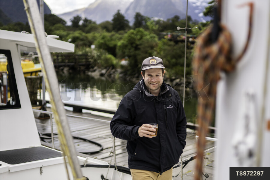 Man on Boat with Drink
