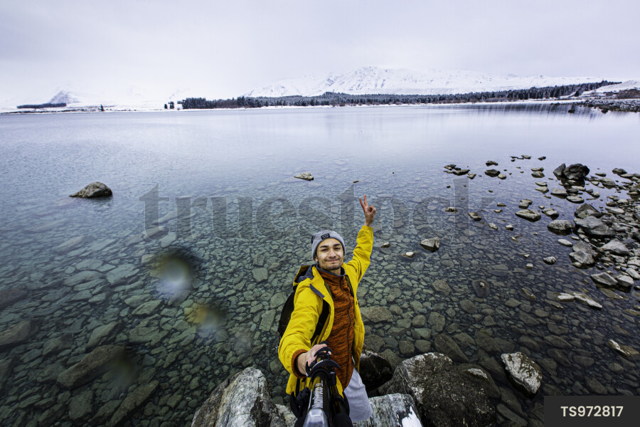 Tourist Taking Selfie by Lake