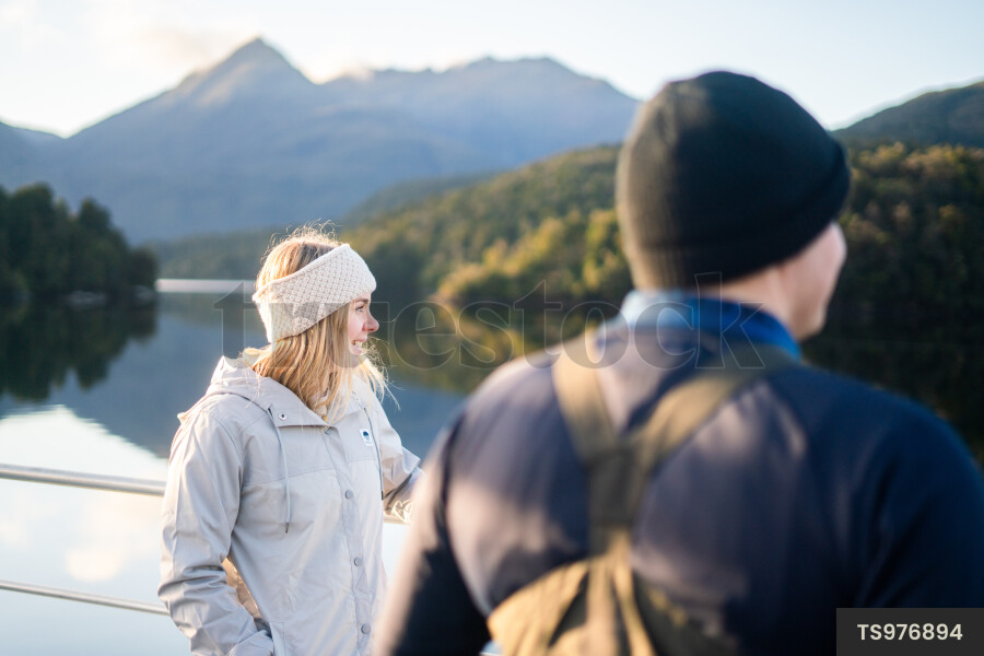 Man and boy on boat at sunrise