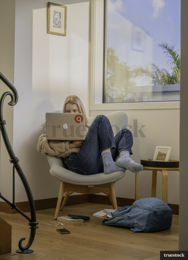 Teenager with Laptop at Home