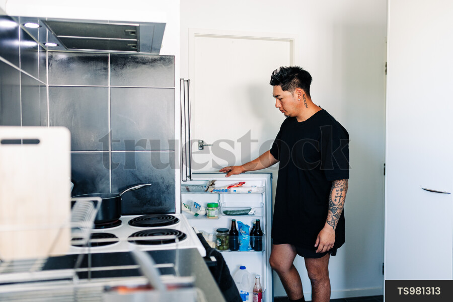 Man looking in fridge