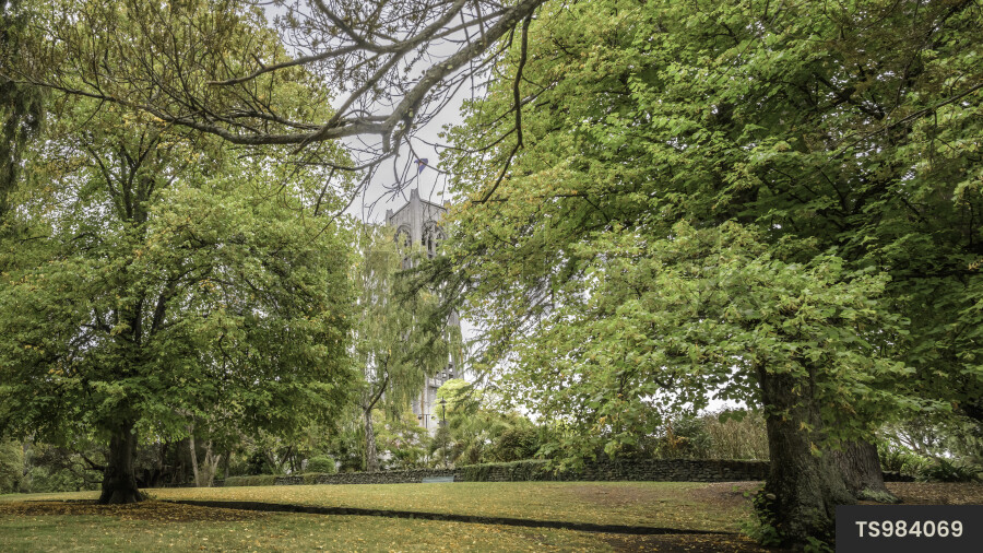 Scenic landscape building with stone wall next to park