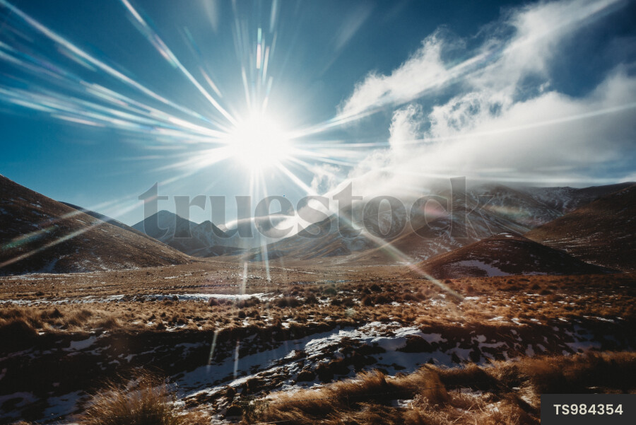 Sunshine above mountain range in Canterbury