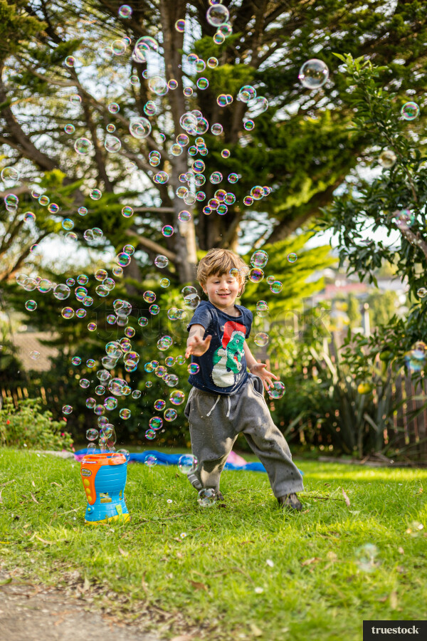 Child playing with bubbles