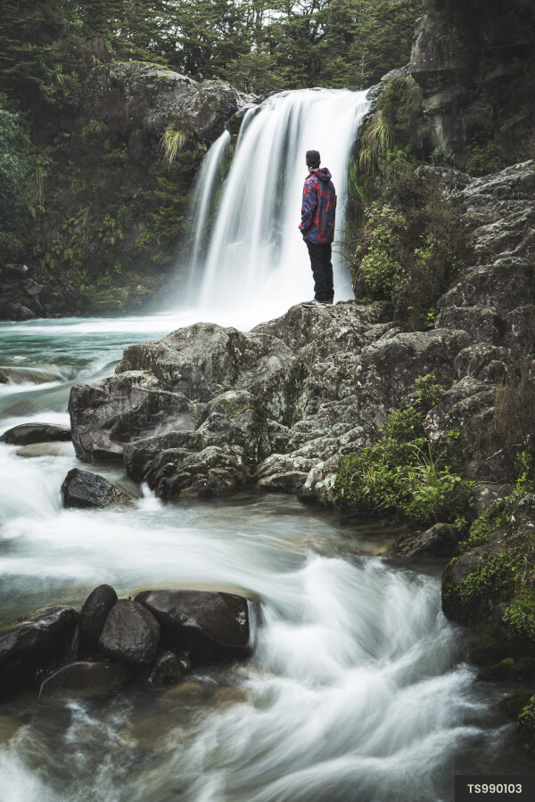Man by Waterfall in Bush