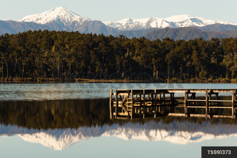 Jetty on Lake Mahinapua and mountain