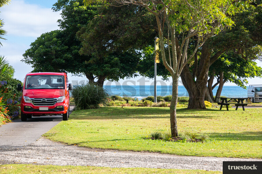 Courier van delivery to a home near beach