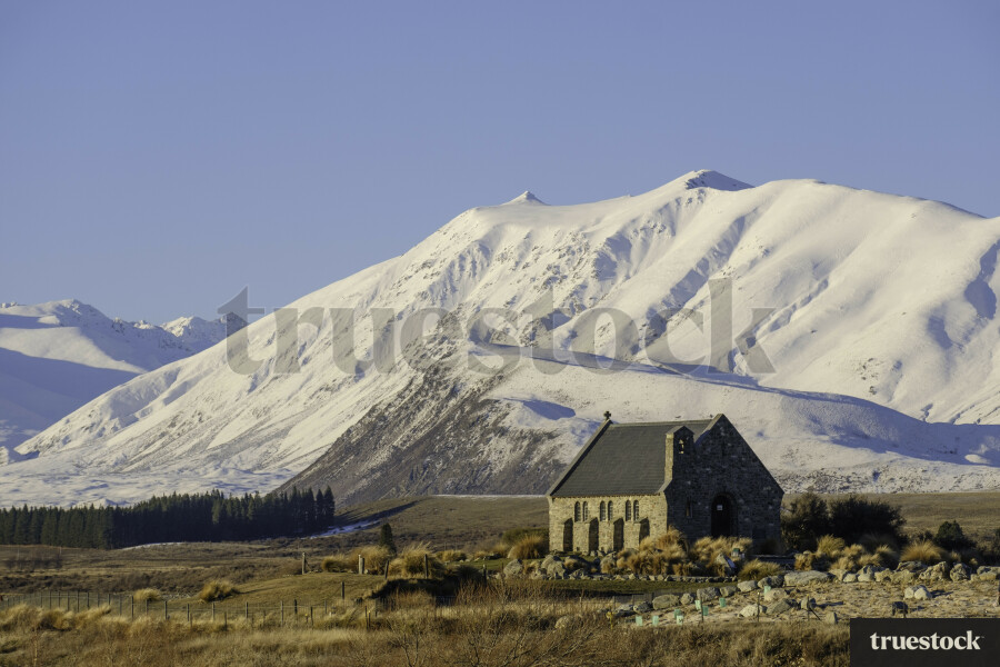 Church amongst snowy mountains