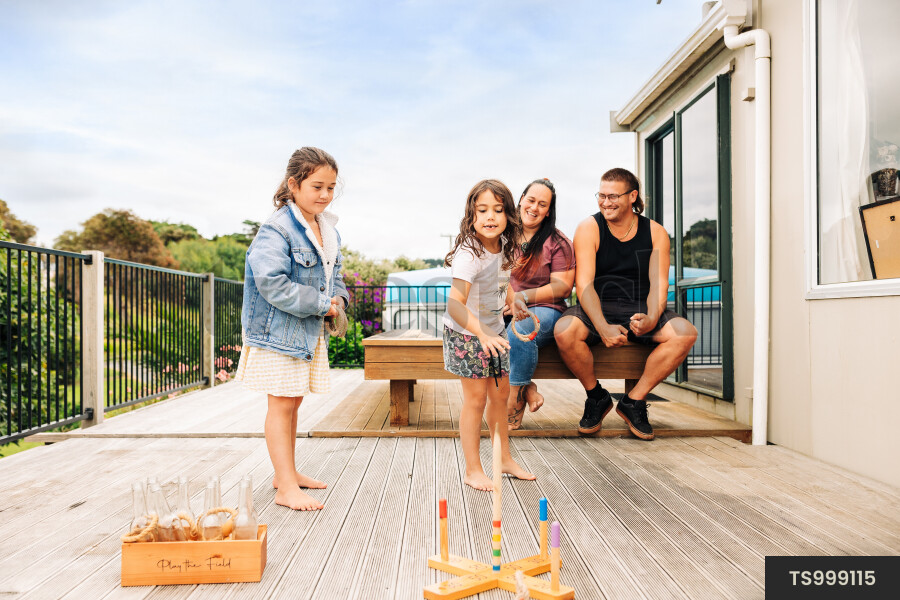 Family playing on deck